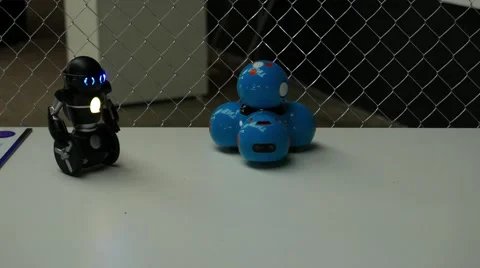 Two small toy robos on a table Stock Footage 67251285