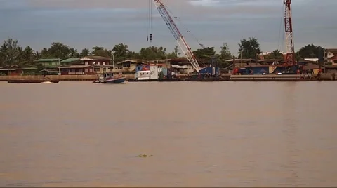 Two Small Tug Boats pulling a float in Bangkok canal Stock Footage 43770602