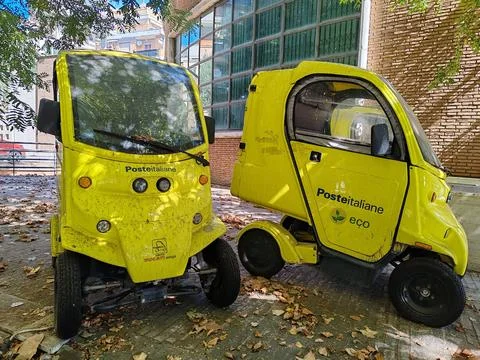 Two small vehicles will deliver mail to customers of Poste Italiane Stock Photos