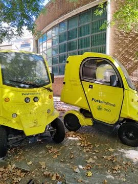Two small vehicles will deliver mail to customers of Poste Italiane Stock Photos