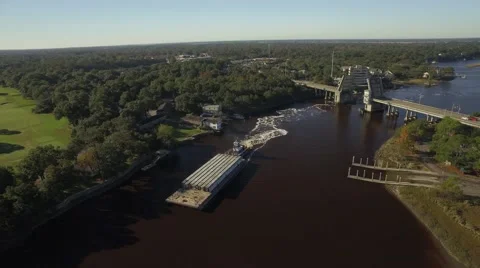 Two Smaller Boats Pass Barge Coming Through Toll Bridge Stock Footage 57677935