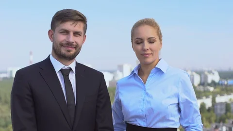 Two smiling company experts looking camera, skilled business people, service Stock-Footage 117210932