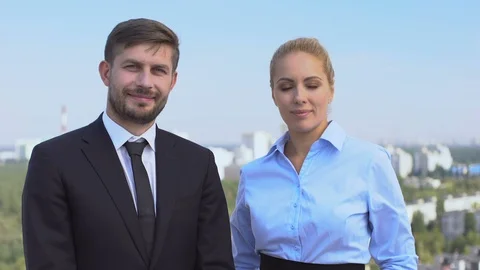 Two smiling company experts looking camera, skilled business people, service Vídeo Stock 117217170