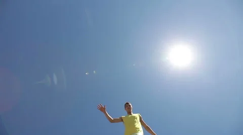 Two smiling men on stilts step over the camera Stock Footage 54027949