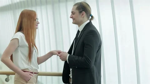 Two smiling professionals engaging in a friendly handshake Stock Footage 311810578