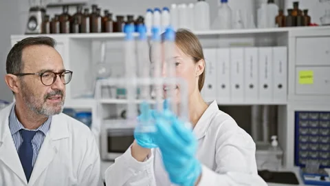 Two smiling scientists, partners in science, working together in a lab, ana.. Stock Footage 262770438