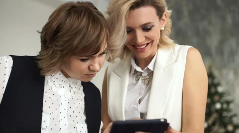 Two smiling women with tablet Stock Footage 68983611