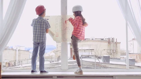 Two smiling young Builder planning the construction work Video stock 104848313