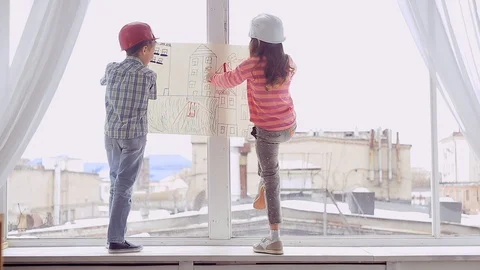 Two smiling young Builder planning the construction work Stock Footage 107366188