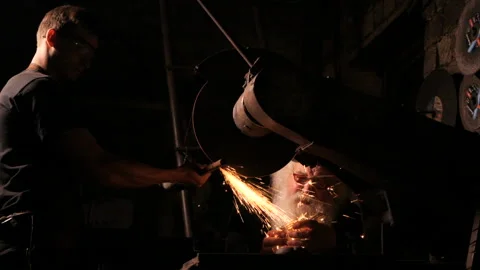 Two smiths is working in a smithy Stock Footage 103876423