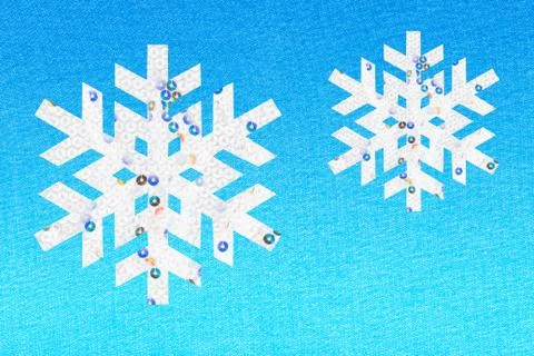 Two snowflakes on blue background 스톡 일러스트