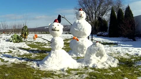 Two snowmen in the snow time lapse Stock Footage 55698104