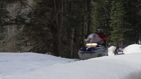 Two Snowmobiles in forest Stock Footage 46832772