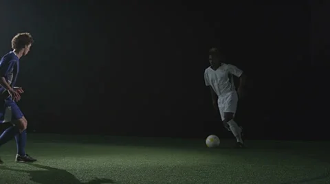 Two soccer players face off and try to outdo each other Stock Footage 34008353