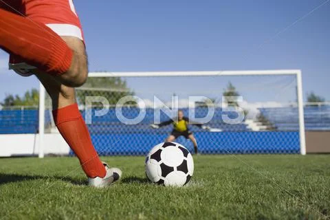 Two Soccer Players Taking A Break