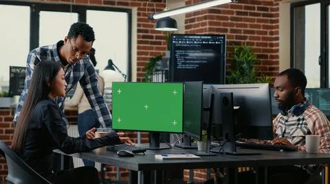 Two software developers analyzing source code looking at green screen chroma key 스톡 사진