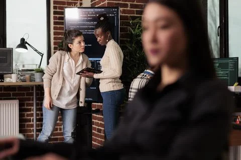 Two software developers analyzing source code Foto stock
