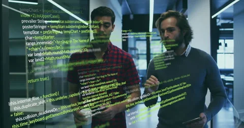 Two software developers walking, code overlay appearing on glass, causing Stock Footage 315562984