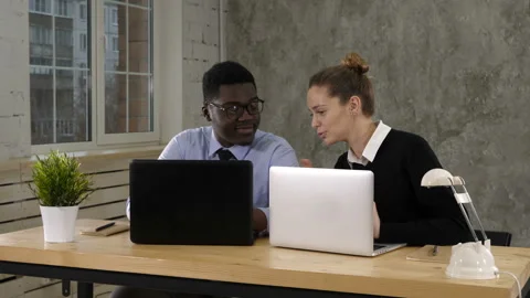 Two software developers working on a new project Stock Footage 99441197