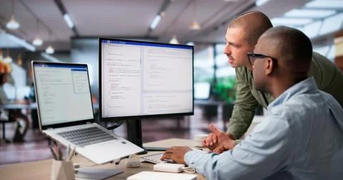 Two Software Engineers Collaborate On Secure Coding For Cloud Systems. 写真素材