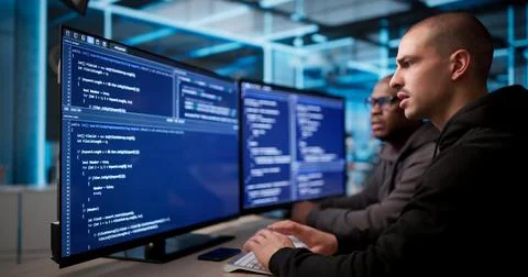 Two Software Engineers Discuss And Develop Secure Business Applications Toget Stockfoto's