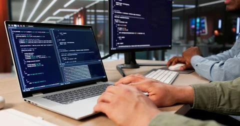 Two Software Engineers Working Together On Secure Data Coding Project. Stock Photos
