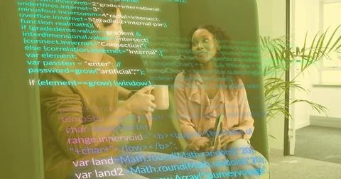 Two software professionals discussing code overlay on sofa in office lounge, Stock Photos