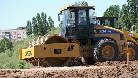 Two soil skating rinks working to seal ground the base of road Construction 스톡 동영상 130407264