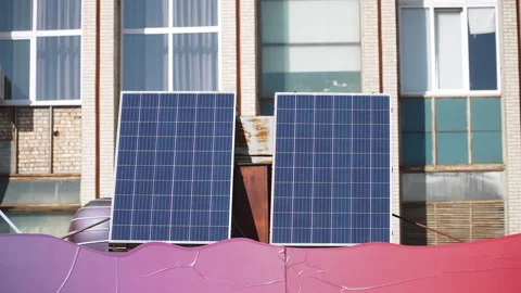 Two solar panels are located on roof of extension next to industrial building. Stock Footage 330535037