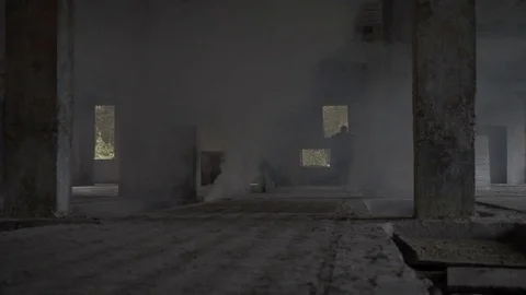 Two soldiers run through the building in smoke Stock Footage 77031345