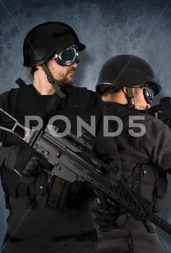 Two soldiers, swat and police concept Stock Photos