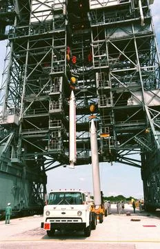 Two solid rocket boosters are lifted up the tower on Launch Pad 17A, Cape ... Stock Photos