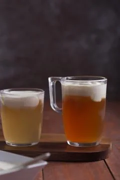 Two sorts of cheese tea with layer of creamy foam Stock Photos