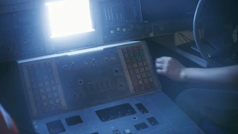 Two space technicians operating the control board in cockpit Stock Footage 109278646