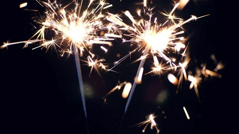 Two sparklers on a dark background Video stock 98086301