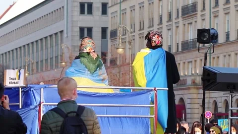 Two Speakers Covered With Flag Of Ukraine At Demonstration Against War Stock Footage 185737451