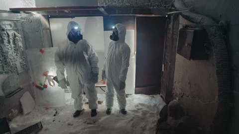 Two specialists gather radioactive samples in chilly structure. Scientists in Stock Footage 346521319