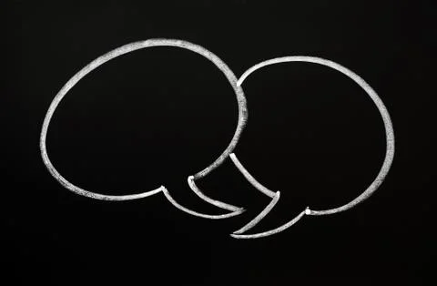 Two speech bubbles on a blackboard Stock Photos