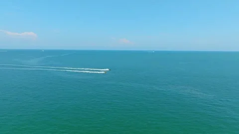 Two speeding water motorcycles racing with each other across Atlantic Ocean Stock Footage 250013006