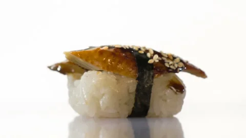 Two spinning eel sushi on the white background. Stock Footage 127148364