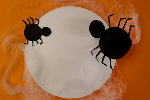 Two spooky spiders on a circular white banner. Halloween invitation cards. Stock Photos