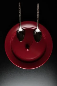 Two spoons and a cherry Stock Photos