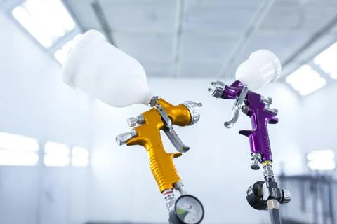 Two spray gun workshop in paint chamber Stock Photos