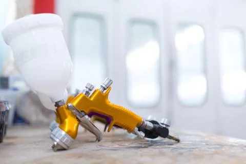Two spray gun workshop in paint chamber Stock Photos