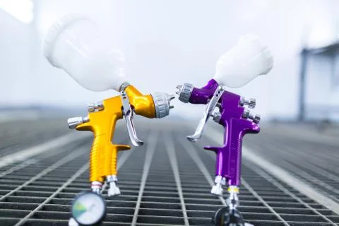 Two spray gun workshop in paint chamber Stock Photos