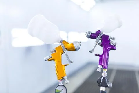 Two spray gun workshop in paint chamber Stock Photos