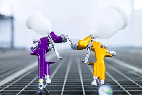 Two spray gun workshop in paint chamber Stock Photos