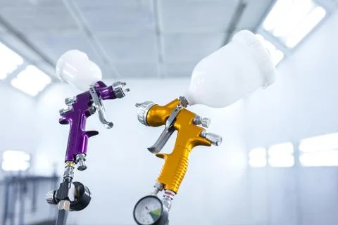 Two spray gun workshop in paint chamber Stock Photos