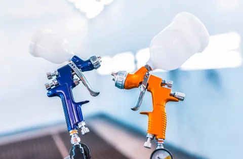 Two spray gun workshop in paint chamber Stock Photos