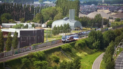 Two sprinter trains passing each other at Lent train station, Nijmegen Stockbeeldmateriaal 111346202